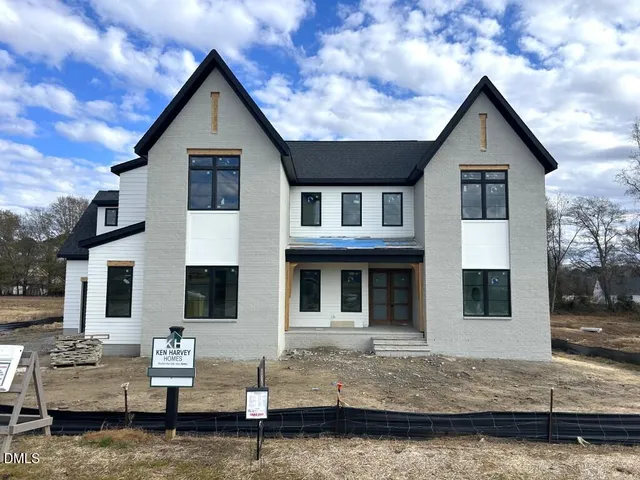 a front view of a house with yard