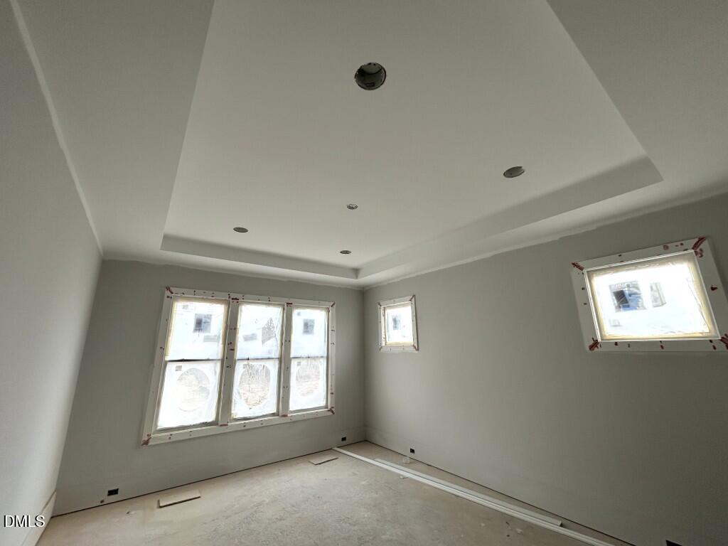 5841 Carriage Drive Raleigh, NC 27603 - Photo 9 of 33 an empty room with windows