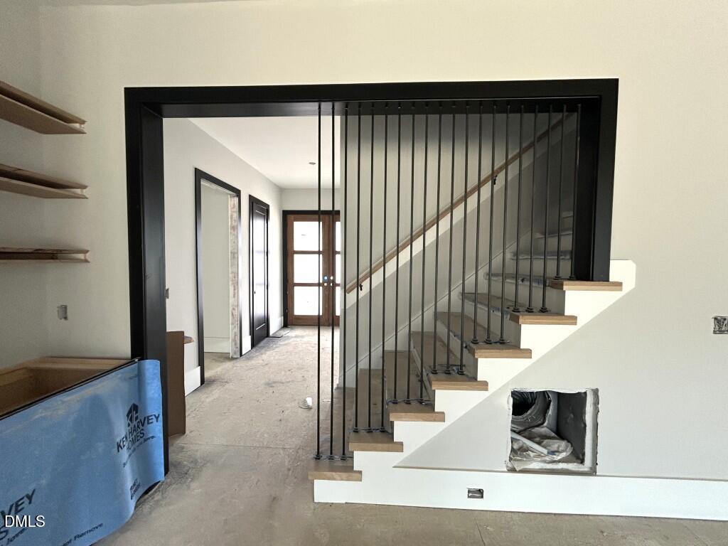 5841 Carriage Drive Raleigh, NC 27603 - Photo 11 of 33 a view of entryway and hall with wooden floor