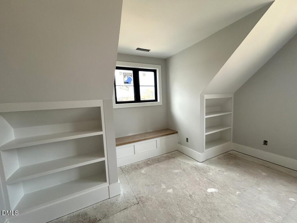 5841 Carriage Drive Raleigh, NC 27603 - Photo 13 of 33 a view of an empty room with a window