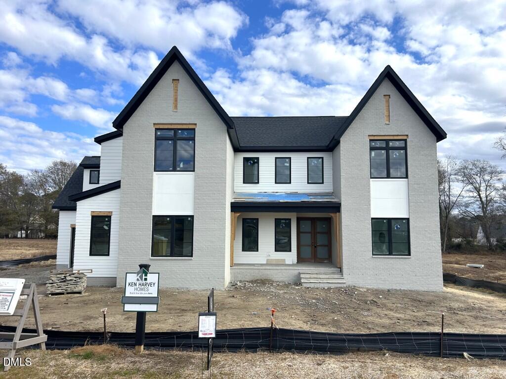 5841 Carriage Drive Raleigh, NC 27603 - Photo 2 of 33 a front view of a house with windows