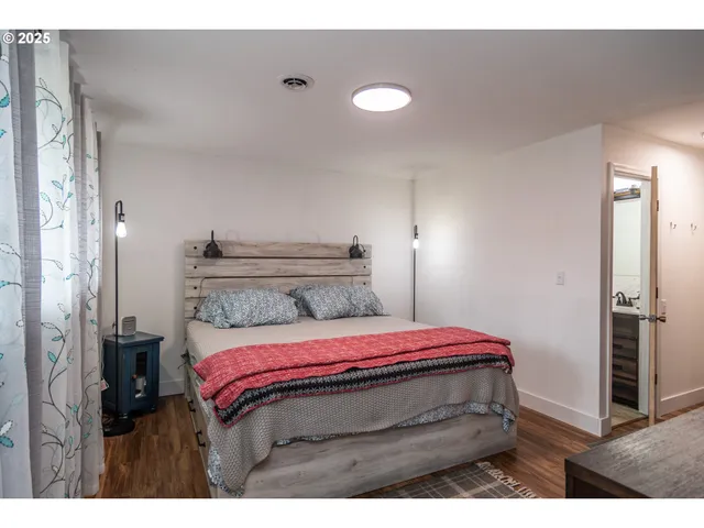 a bedroom with a bed and a view of bathroom