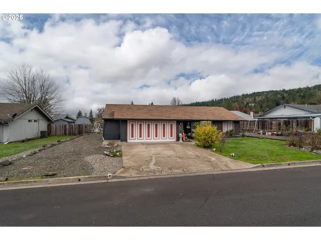a view of a street with a bench in front of it