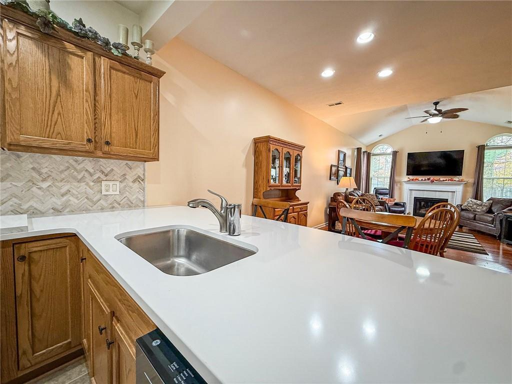 2113 Winchester Court Renfrew, PA 16053 - Photo 13 of 45 a kitchen with stainless steel appliances granite countertop a sink and a cabinets with wooden floor