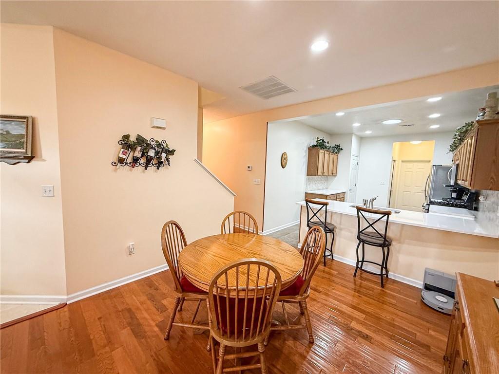 2113 Winchester Court Renfrew, PA 16053 - Photo 17 of 45 a view of a dining room with furniture and wooden floor