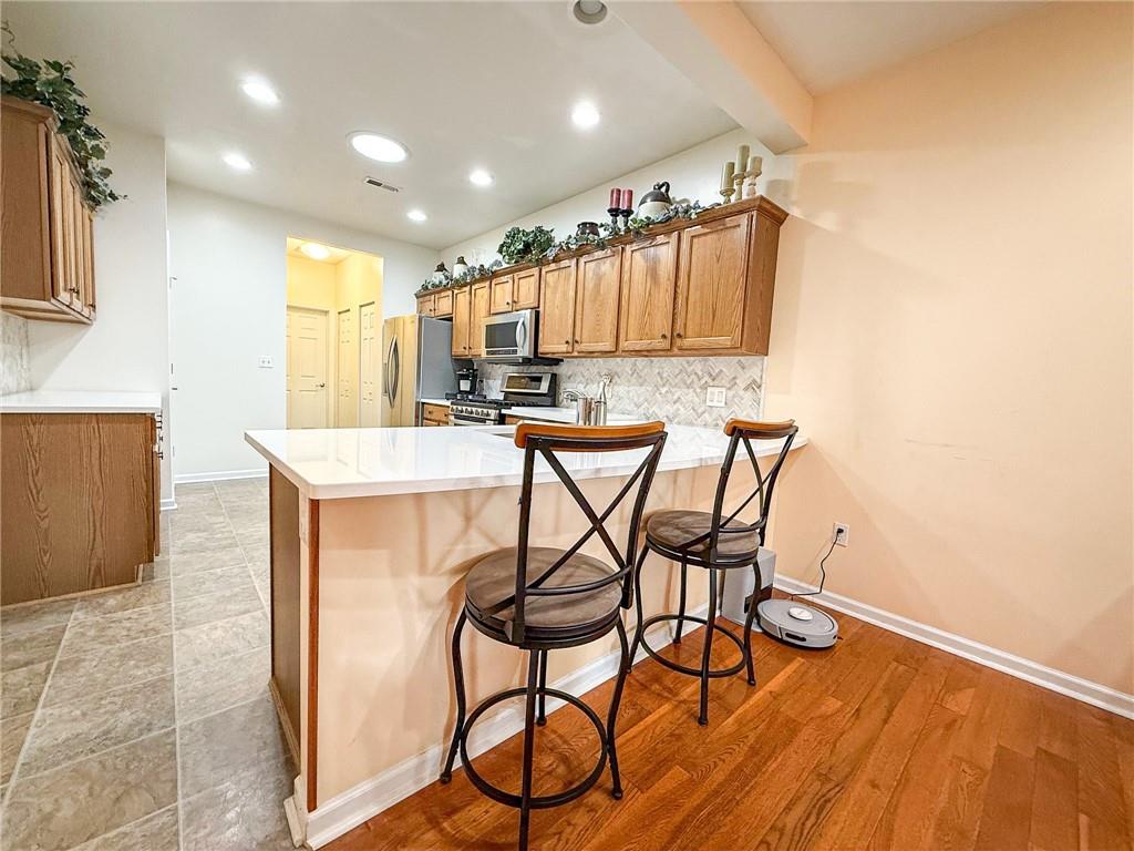 2113 Winchester Court Renfrew, PA 16053 - Photo 20 of 45 a view of a dining room with furniture and wooden floor