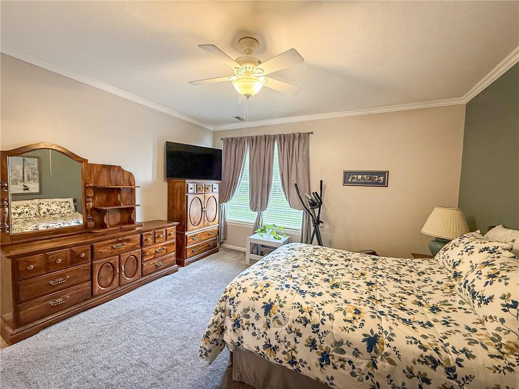 2113 Winchester Court Renfrew, PA 16053 - Photo 22 of 45 a bedroom with a bed and a flat screen tv