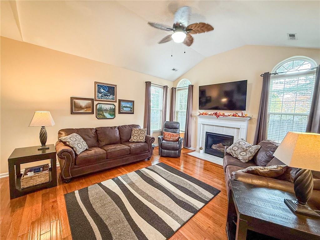 2113 Winchester Court Renfrew, PA 16053 - Photo 3 of 45 a living room with furniture a fireplace and a flat screen tv
