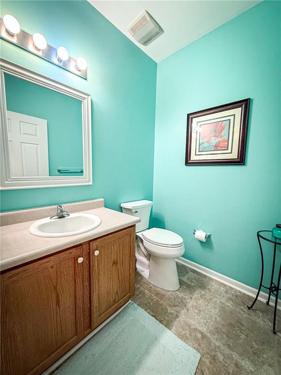 2113 Winchester Court Renfrew, PA 16053 - Photo 32 of 45 a bathroom with a toilet sink and mirror