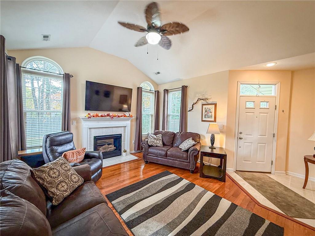 2113 Winchester Court Renfrew, PA 16053 - Photo 4 of 45 a living room with furniture a fireplace and a flat screen tv