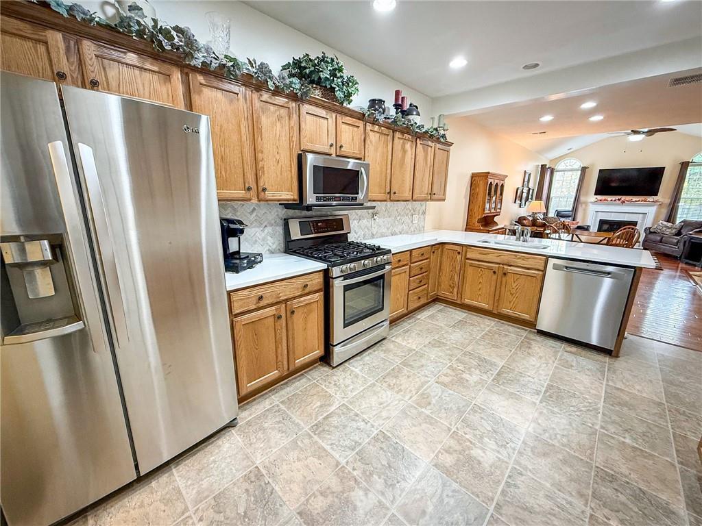 2113 Winchester Court Renfrew, PA 16053 - Photo 8 of 45 a kitchen with granite countertop a refrigerator oven a sink dishwasher and white cabinets