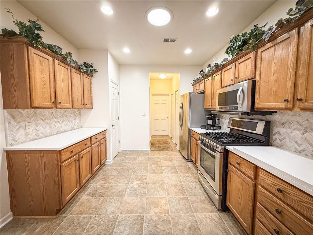 2113 Winchester Court Renfrew, PA 16053 - Photo 10 of 45 a large kitchen with stainless steel appliances granite countertop a stove a sink and a microwave