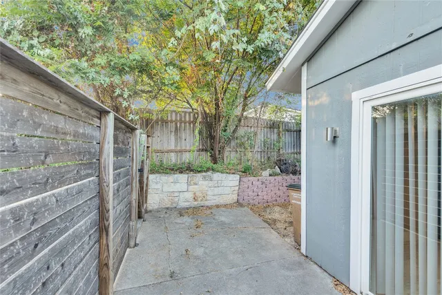 a view of a wooden door and a yard