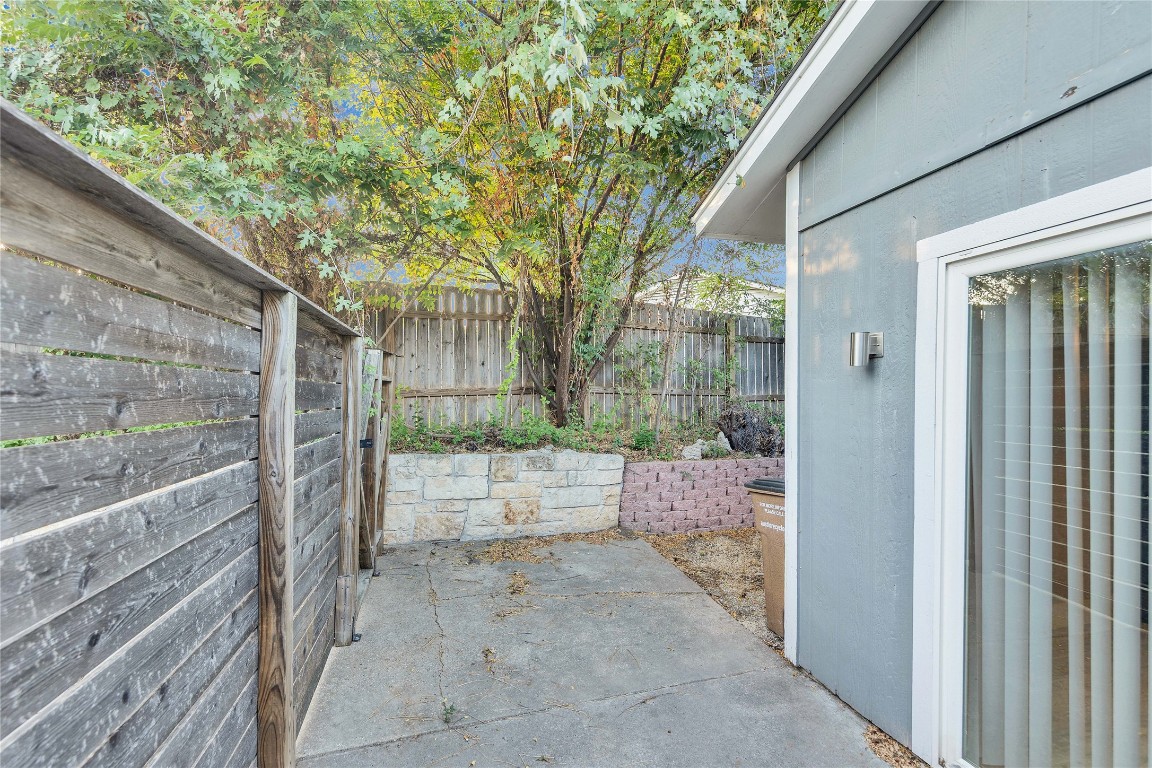 4721 Blueberry Trail, Unit A Austin, TX 78723 - Photo 20 of 23 a view of a wooden door and a yard