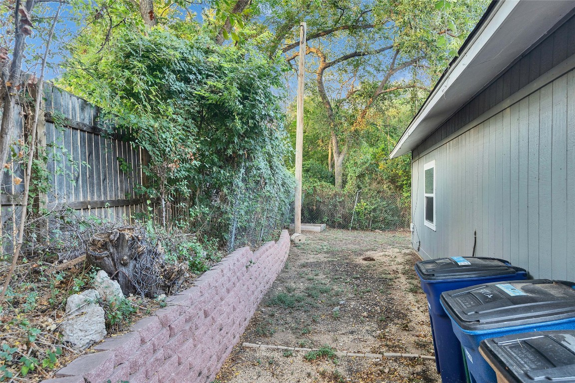 4721 Blueberry Trail, Unit A Austin, TX 78723 - Photo 21 of 23 a backyard of a house with lots of green space