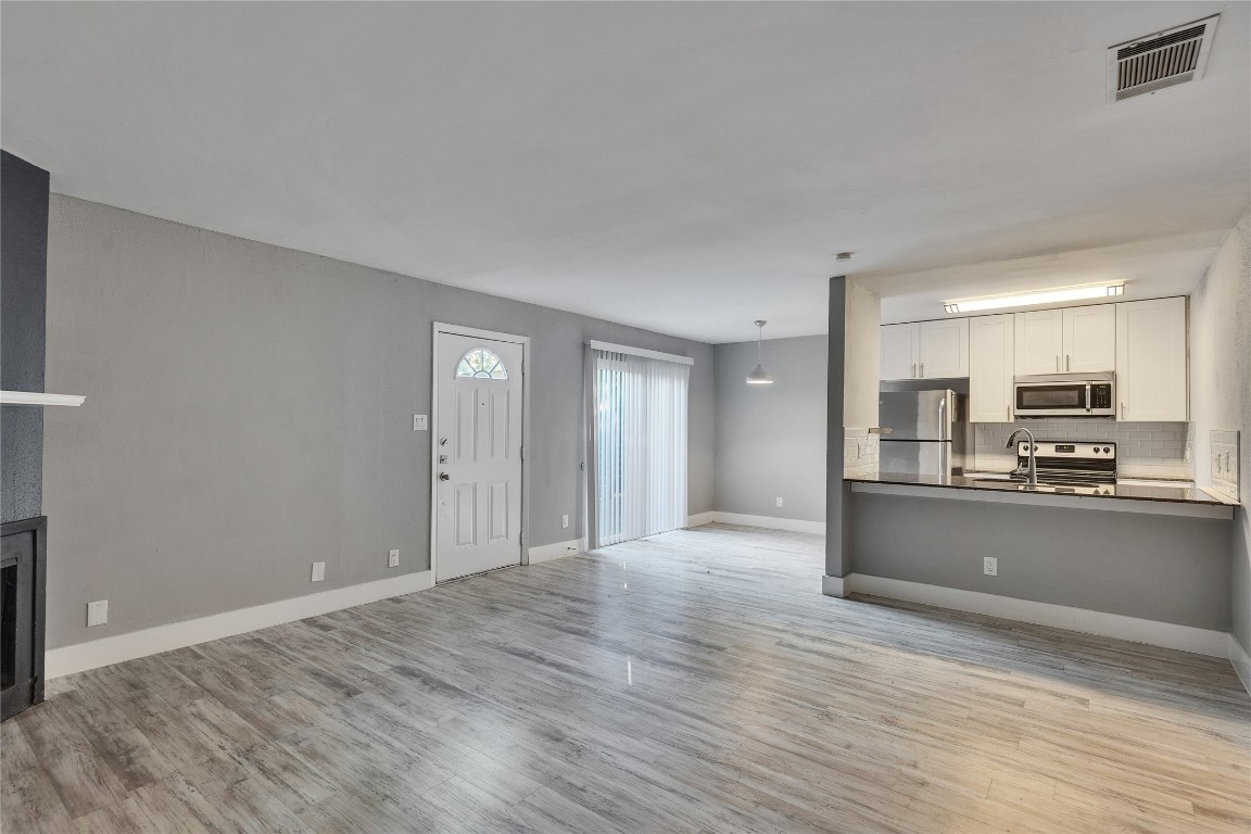 4721 Blueberry Trail, Unit A Austin, TX 78723 - Photo 5 of 23 a view of kitchen and wooden floor