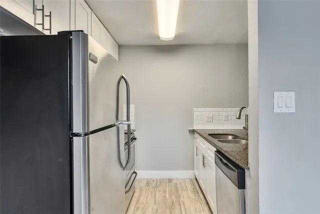 a kitchen with a stove a refrigerator and a stove