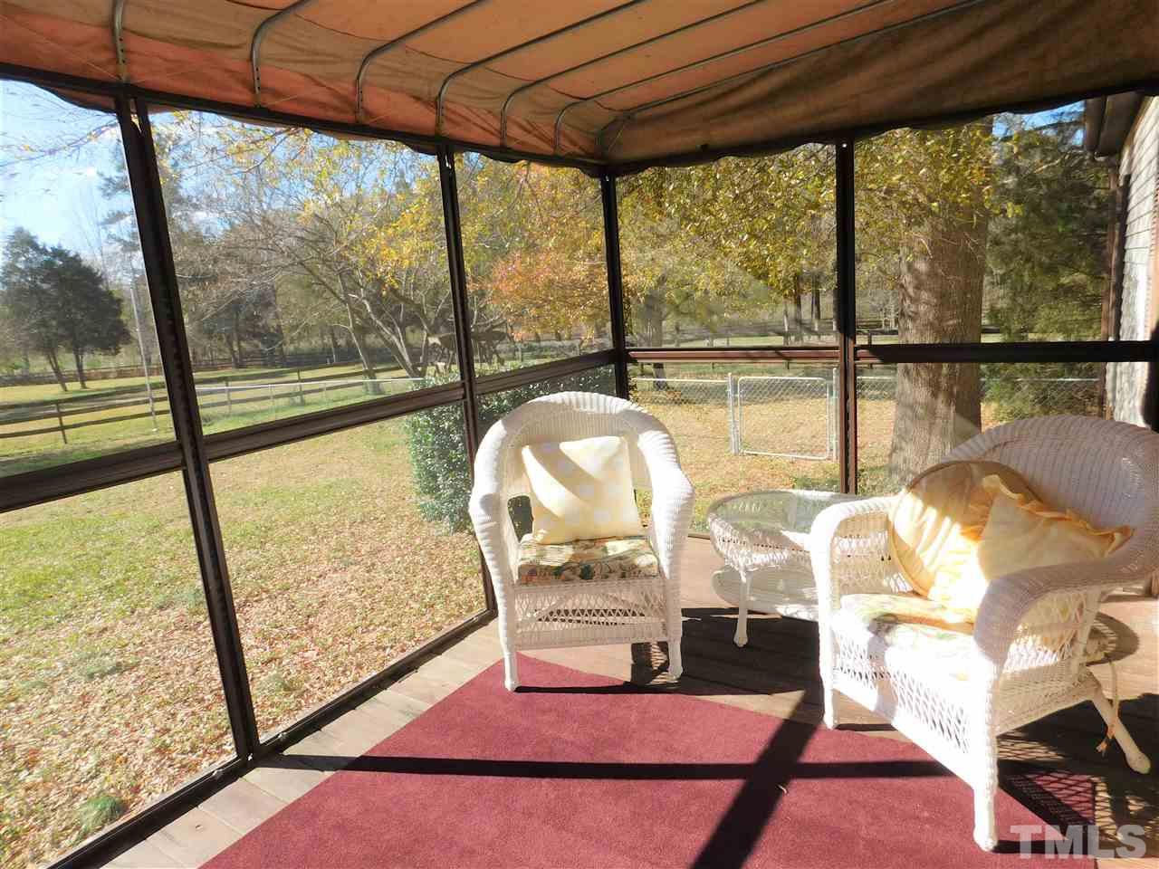 9402 Hampton Road Rougemont, NC 27572 - Photo 15 of 18 a living room with large windows