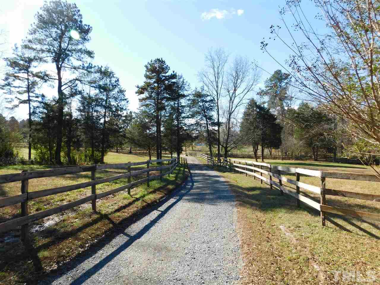 9402 Hampton Road Rougemont, NC 27572 - Photo 16 of 18 a view of a park with large trees