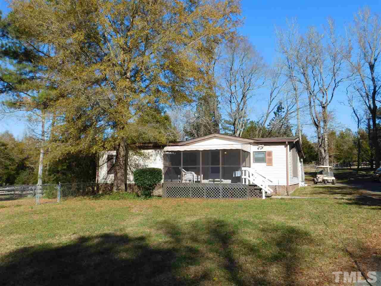 9402 Hampton Road Rougemont, NC 27572 - Photo 3 of 18 a front view of house with yard and trees
