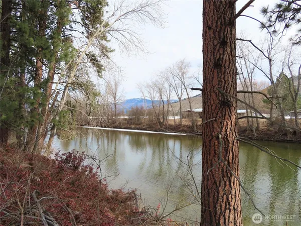 a view of a lake with a yard
