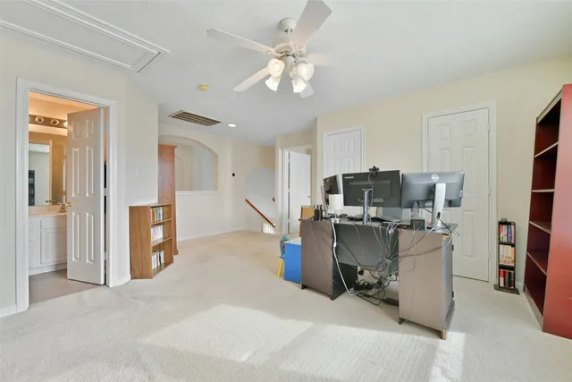 a view of a kitchen with refrigerator and workspace
