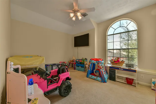 a living room with lots of furniture and a flat screen tv