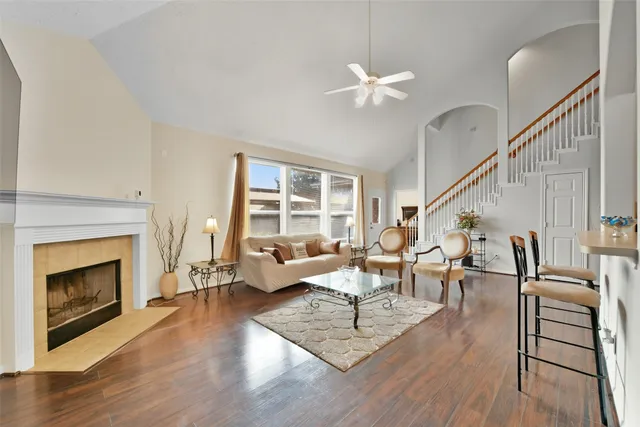 a living room with furniture and a fireplace
