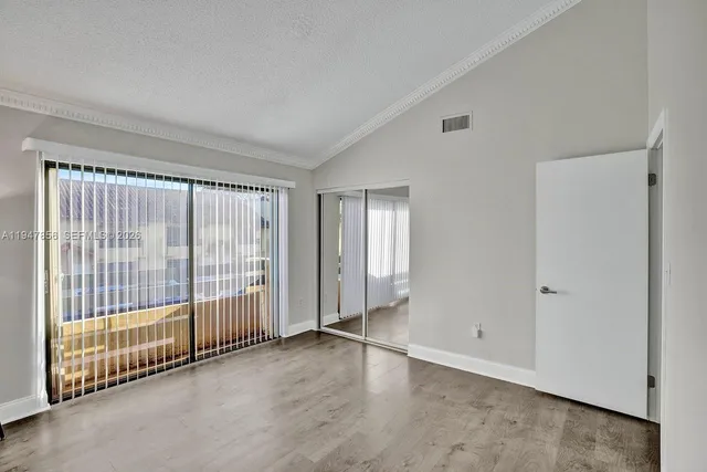 a bathroom with a double vanity sink toilet mirror and shower