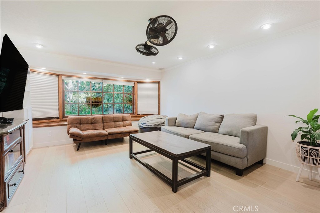 25261 Avenida Rondel Valencia, CA 91355 - Photo 14 of 68 a living room with furniture and a flat screen tv