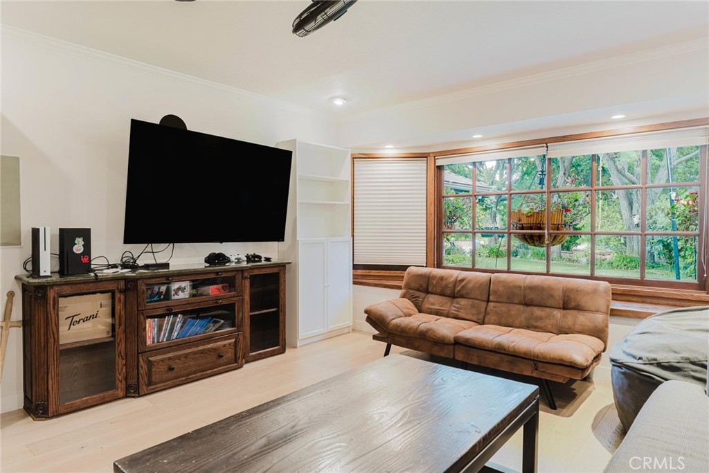 25261 Avenida Rondel Valencia, CA 91355 - Photo 15 of 68 a living room with furniture and a flat screen tv