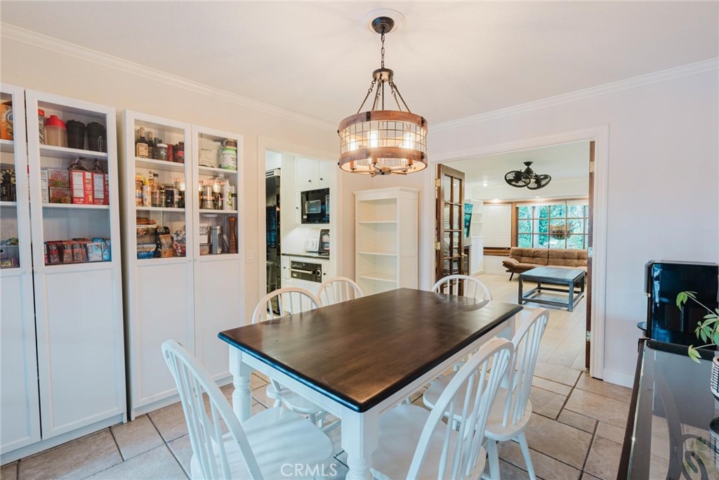 25261 Avenida Rondel Valencia, CA 91355 - Photo 17 of 68 a view of a dining room with furniture window and wooden floor
