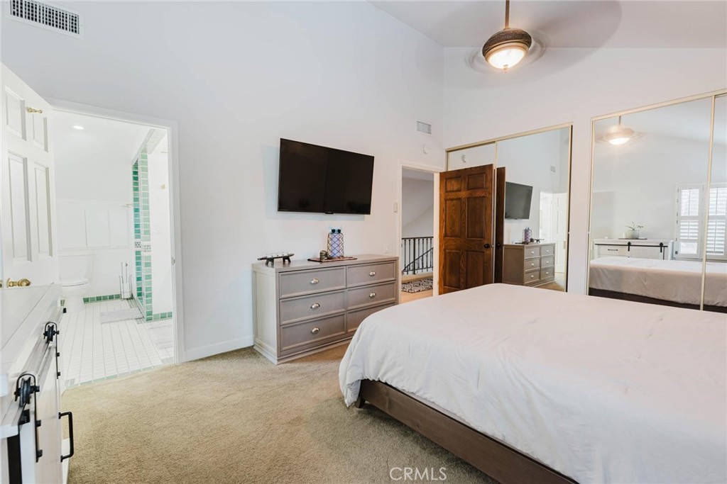25261 Avenida Rondel Valencia, CA 91355 - Photo 22 of 68 a bedroom with a bed and a flat screen tv