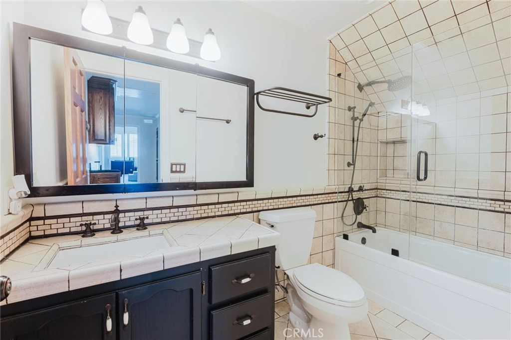 25261 Avenida Rondel Valencia, CA 91355 - Photo 26 of 68 a bathroom with a sink a toilet and shower