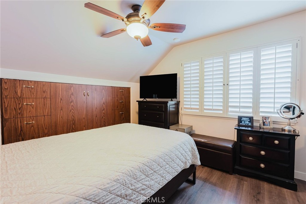 25261 Avenida Rondel Valencia, CA 91355 - Photo 28 of 68 a bedroom with a bed and a flat screen tv