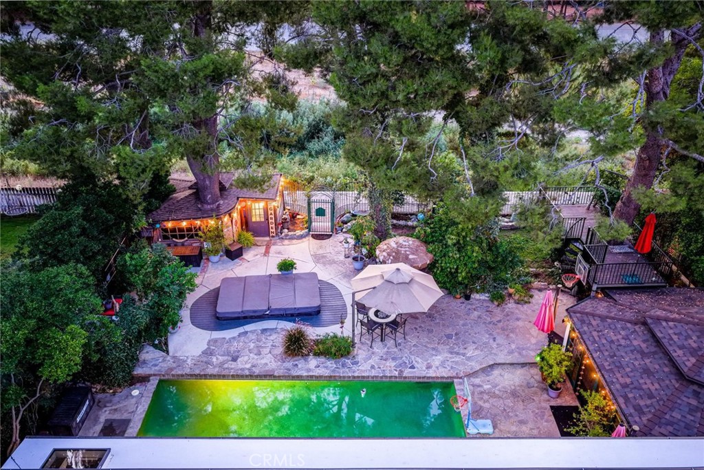 25261 Avenida Rondel Valencia, CA 91355 - Photo 30 of 68 an aerial view of a house with a yard and lake view