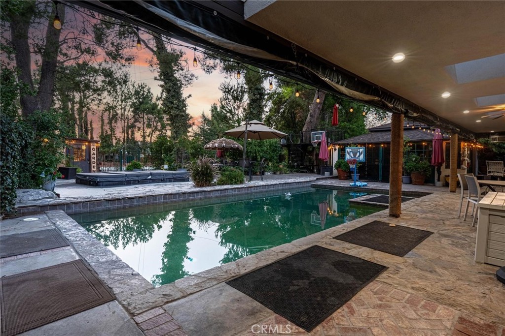 25261 Avenida Rondel Valencia, CA 91355 - Photo 31 of 68 a view of a swimming pool with a patio