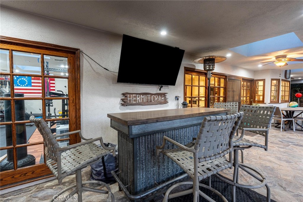 25261 Avenida Rondel Valencia, CA 91355 - Photo 33 of 68 a view of a livingroom with furniture and a flat screen tv