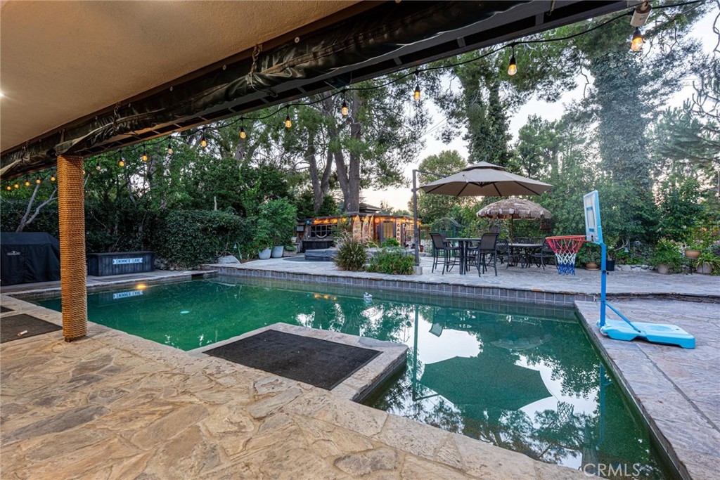 25261 Avenida Rondel Valencia, CA 91355 - Photo 34 of 68 a view of a swimming pool with a patio