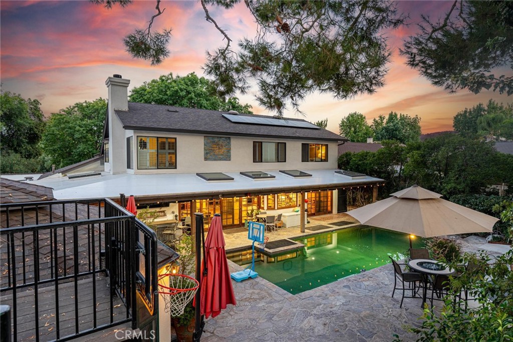 25261 Avenida Rondel Valencia, CA 91355 - Photo 42 of 68 a view of a house with a yard and a patio