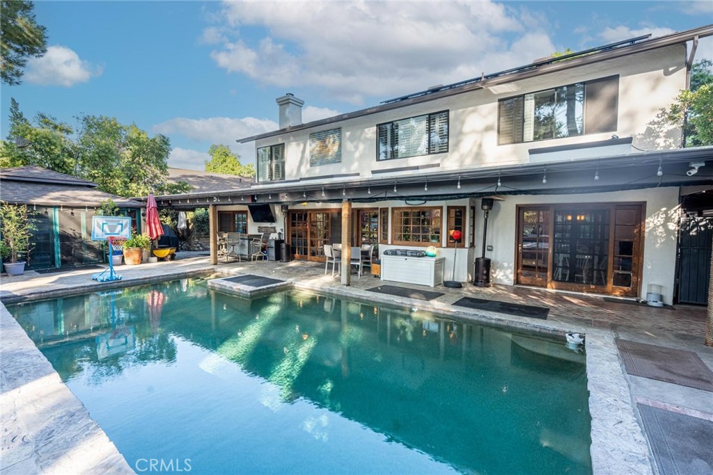 25261 Avenida Rondel Valencia, CA 91355 - Photo 52 of 68 a view of house with swimming pool and a yard