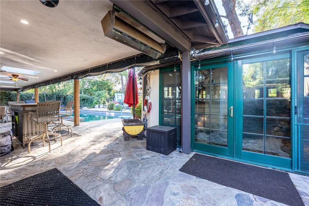 25261 Avenida Rondel Valencia, CA 91355 - Photo 56 of 68 a view of a porch with chairs and backyard