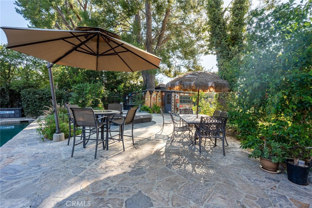 25261 Avenida Rondel Valencia, CA 91355 - Photo 58 of 68 a view of a tables and chairs under an umbrella