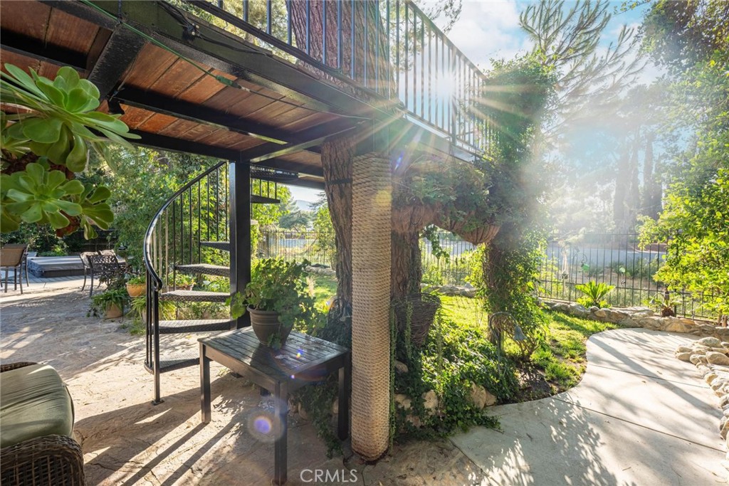 25261 Avenida Rondel Valencia, CA 91355 - Photo 60 of 68 a view of a porch with chairs and backyard