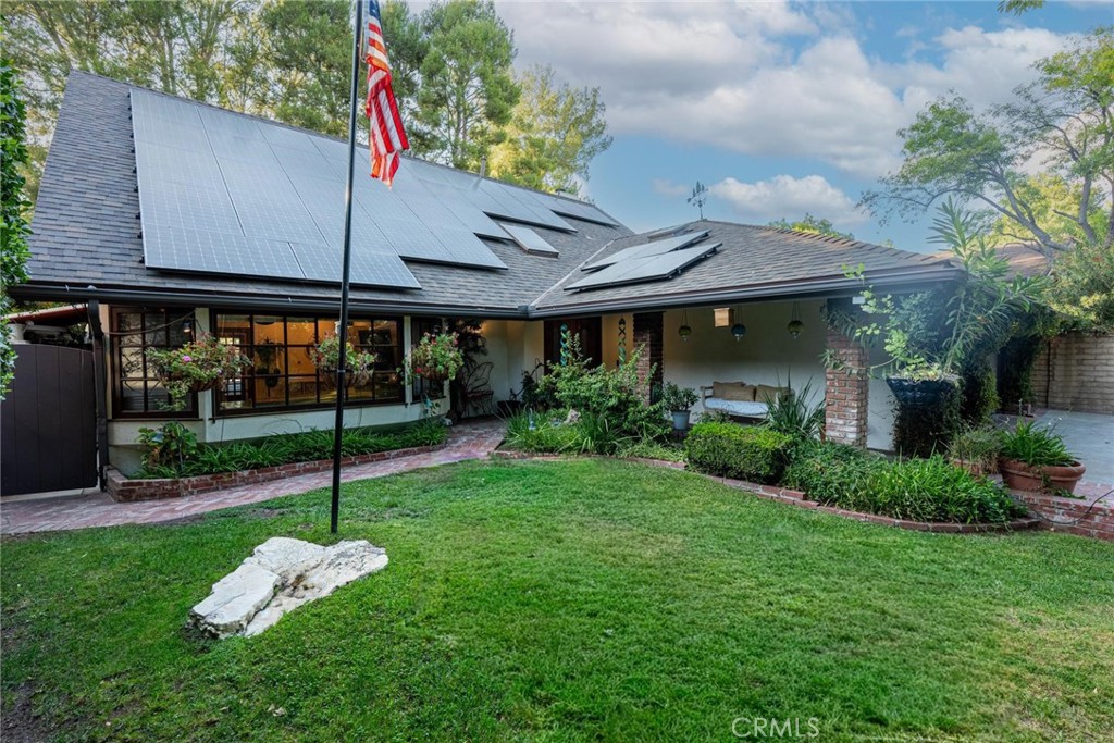 25261 Avenida Rondel Valencia, CA 91355 - Photo 66 of 68 a front view of a house with a yard