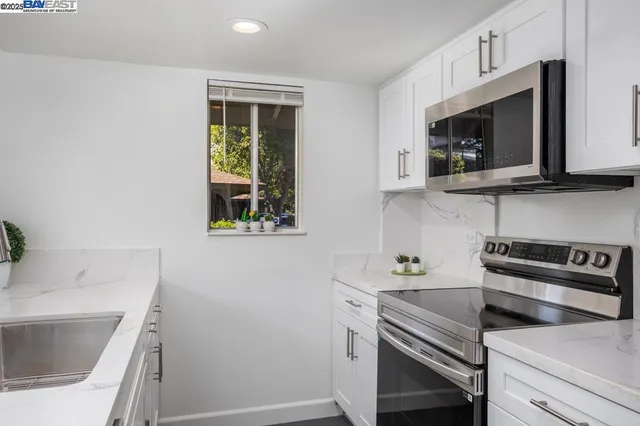 a kitchen with a sink and a microwave