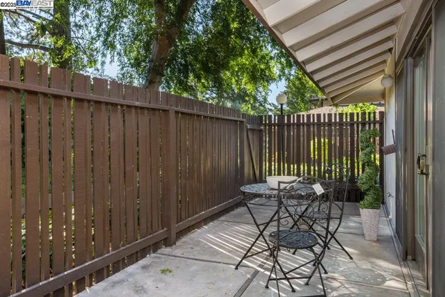 a view of table and chair in the balcony