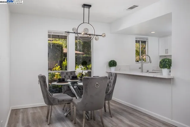a view of a dining room with furniture window and outside view