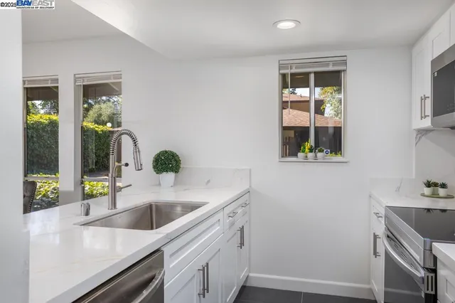 a kitchen with a sink and a window
