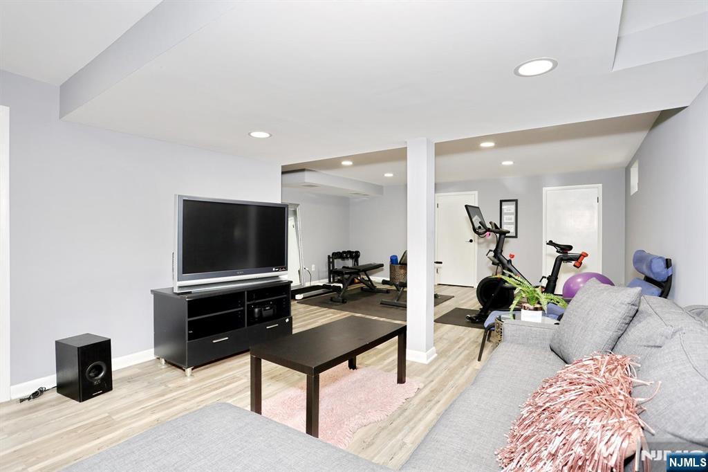 30 Brookfield Road Dumont, NJ 07628 - Photo 33 of 50 a living room with furniture and a flat screen tv